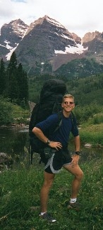 Cave Dog with the Maroon Bells